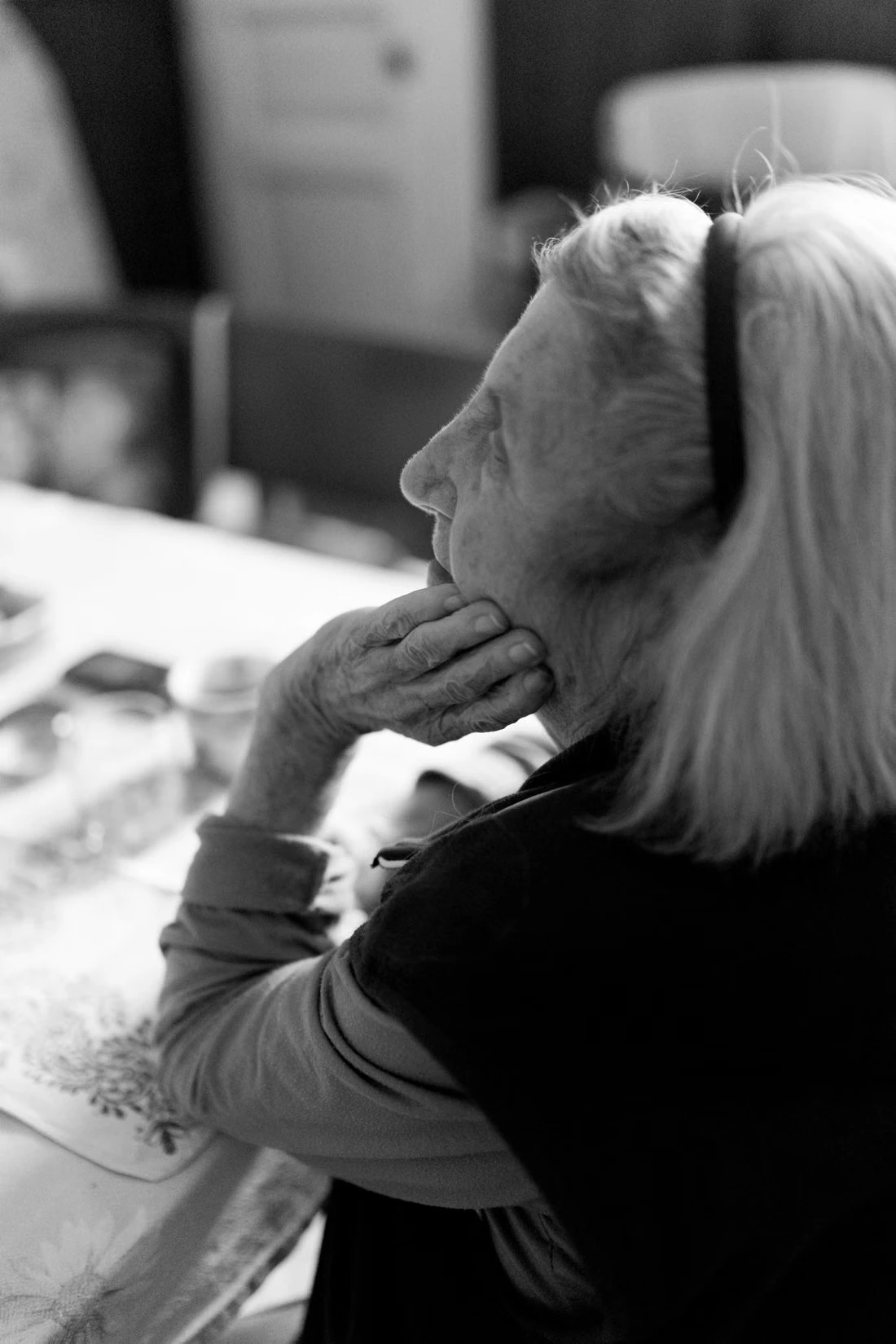 A woman sitting quietly at a table